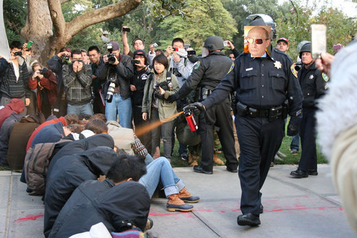 putin police fascism cop macing college students