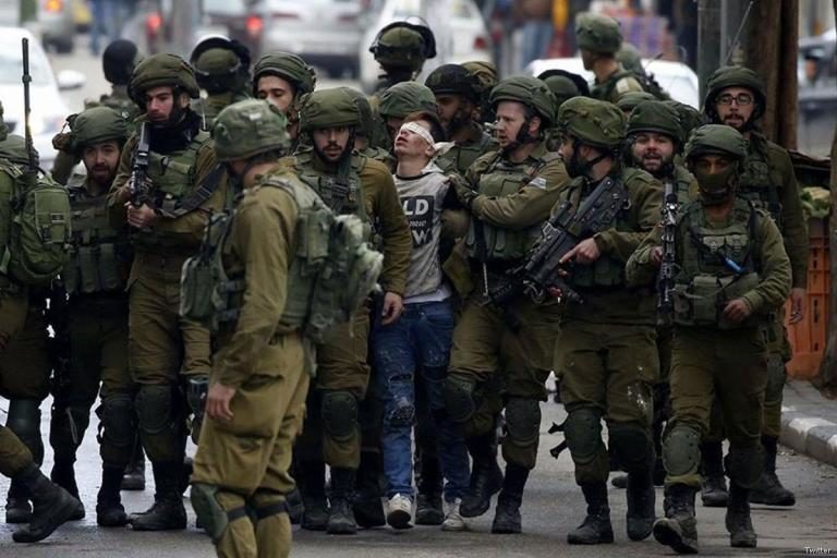 Israeli soldiers Palestinian boy Jerusalem