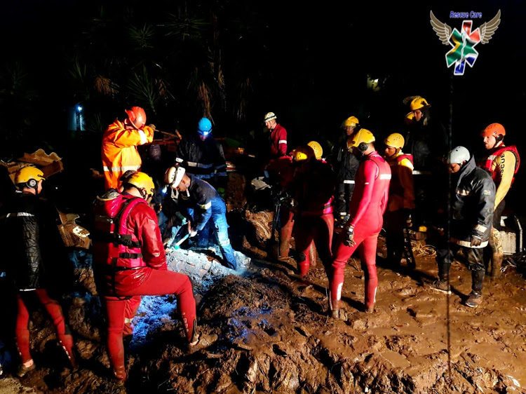 Rescue workers on the scene of a mud slide